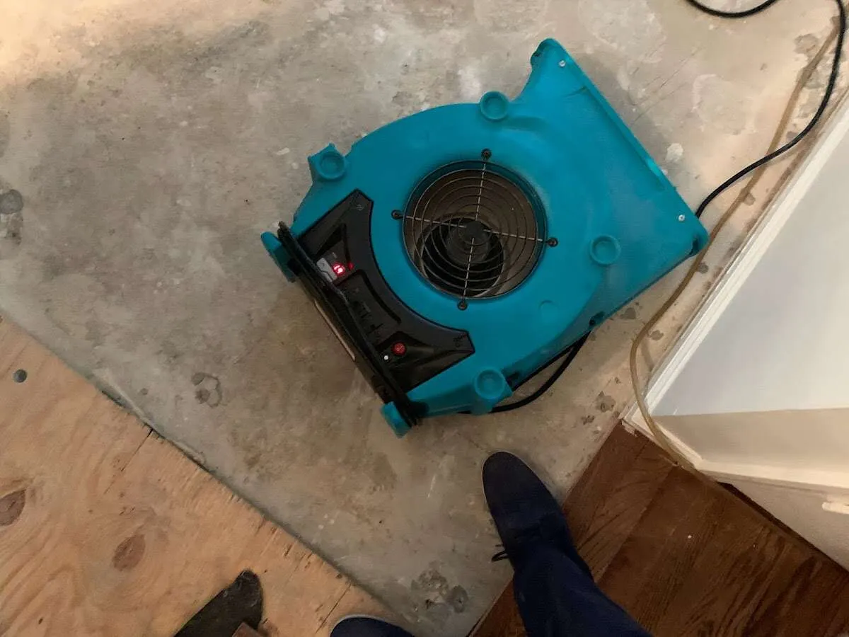 Air mover drying subfloor during Leak Detection & Repair in Ken Caryl
