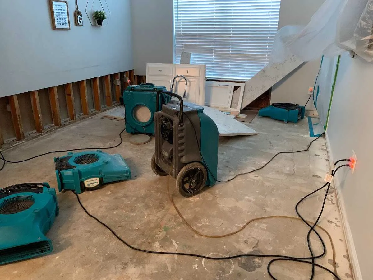 Dehumidifier in flood-cut room for Water Damage Restoration in Ken Caryl